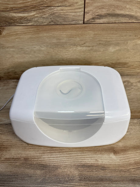 White baby wipe warmer with clear lid on wood surface, ideal for nursery essentials and baby gear