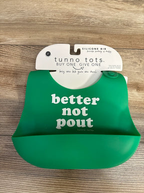 Green silicone baby bib with white text better not pout on wooden background, Tunno Tots brand