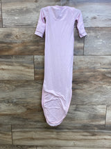 Front view of pink Copper Pearl knotted newborn gown showing long cuffed sleeves and knotted bottom on wood plank background