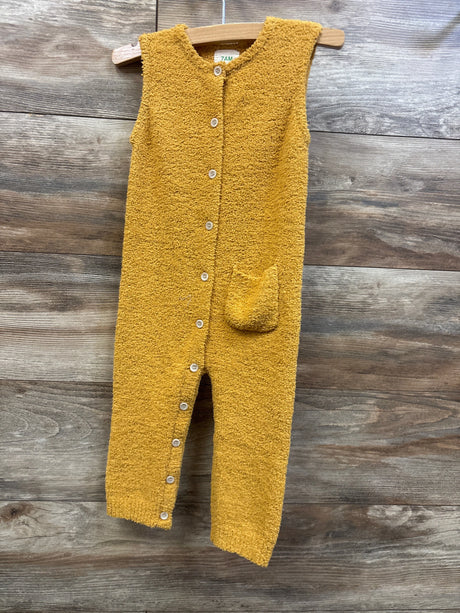 7AM Enfant fuzzy sleeveless jumpsuit in amber yellow for babies, hanging on a wooden hanger.