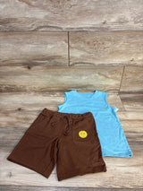 Blue sleeveless kids shirt with brown drawstring shorts on wood background