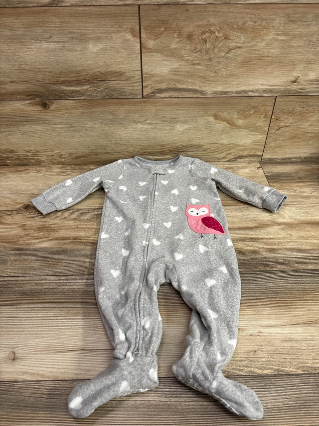 Front view of Carter’s gray blanket sleeper with white hearts, pink owl applique, zipper, and covered feet on a wood floor