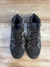 Kids black and gray hiking boots with red laces on wood floor