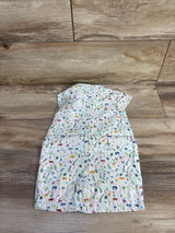 Back view of Janie & Jack white shortie romper showing multicolored jungle animal print and short sleeves on wood floor background