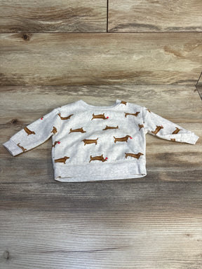 Gray baby sweatshirt with dachshund dog print, long sleeves, laid on wooden floor