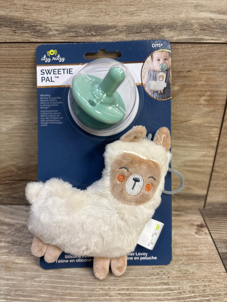 Front view of Itzy Ritzy Sweetie Pal Pacifier Lane the Llama showcasing mint pacifier and plush llama lovey with blue packaging