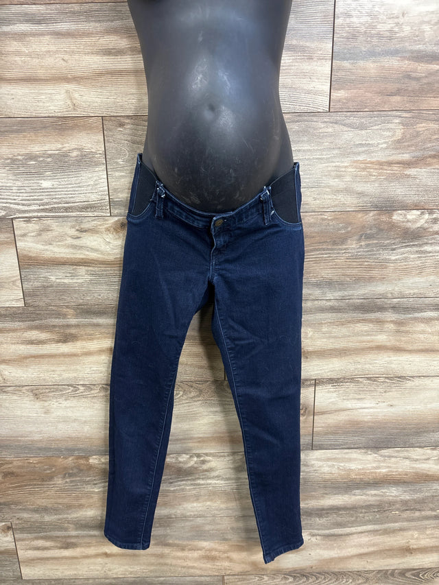 Front view of blue Isabel maternity side-panel jeggings showing elastic side belly panels and skinny legs on wood background