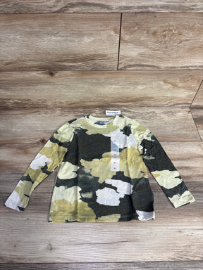Old Navy toddler long sleeve camouflage shirt in green, white, and black on wood floor