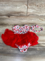 Baby girl strawberry and Minnie Mouse print dress with red tutu skirt and matching headband on wooden floor