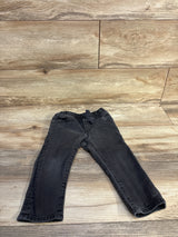 Front flat-lay of Baby Gap toddler grey denim drawstring jeans showing elastic drawstring waistband and straight legs on wood background