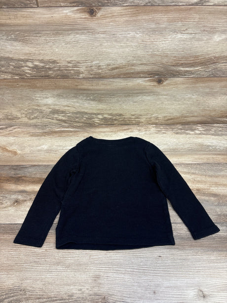 Front view of Old Navy black thermal shirt in size 3T showcasing long sleeves and ribbed knit texture with a wood background