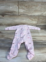 Flat lay of Carter's pink dog-print footed baby sleeper (size 9 months) showcasing long sleeves and all-over dog pattern on wood background