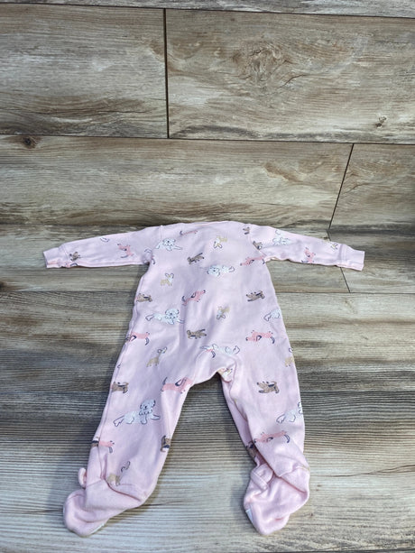 Flat lay of Carter's pink dog-print footed baby sleeper (size 9 months) showcasing long sleeves and all-over dog pattern on wood background
