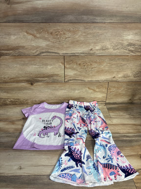 Flat lay of toddler 2-piece purple dinosaur shirt and pastel dinosaur flare pants showing graphic tee and elastic waist on wood floor