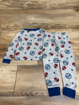 Flat lay of Marvel 2pc Spider-Man pajama set in grey showcasing navy cuffs and Spider-Man print with a wood floor background