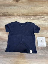 Burt's Bees Baby navy organic cotton onesie, 12M, super soft, laid on wood floor