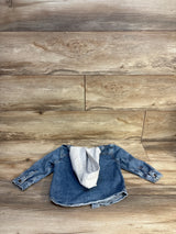 Kids denim jacket with gray hoodie lining, laid flat on wood floor