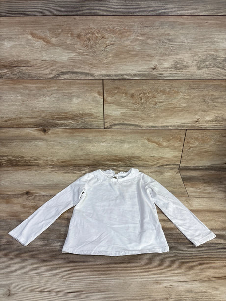 Flat lay of white Oshkosh long-sleeve toddler shirt (size 4T) showing scalloped collar on wood background