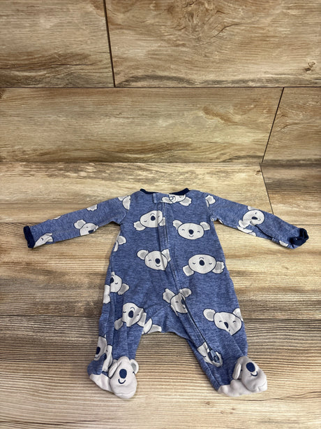 Front view of Carter’s blue newborn sleeper with koala print, zip front, long sleeves, and covered feet on wood-look flooring