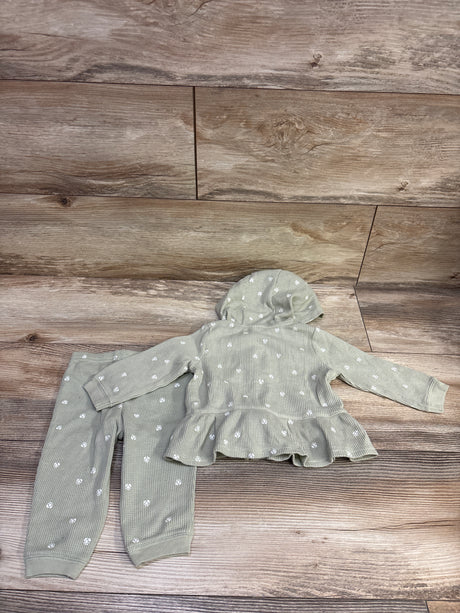Back view of Carter’s 2-piece waffle knit jacket and pants set showcasing hood, floral pattern, and ruffled jacket hem on a wood plank background