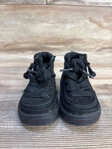Front view of Billy Footwear adaptive black high-top toddler sneakers with laces, side zippers and rubber sole on wood
