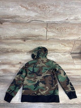 Kids camouflage hoodie with black trim, laid flat on wood floor for resale