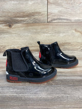 Black polka dot kids' ankle boots with Minnie Mouse design, side zipper, and textured soles