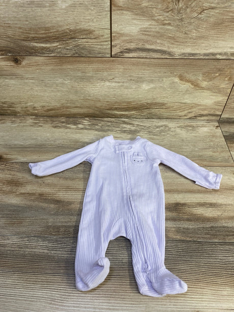 Flat lay of preemie purple ribbed Carter's footed sleeper showcasing front zipper, press-snap neck closure, and bear chest applique on wood background
