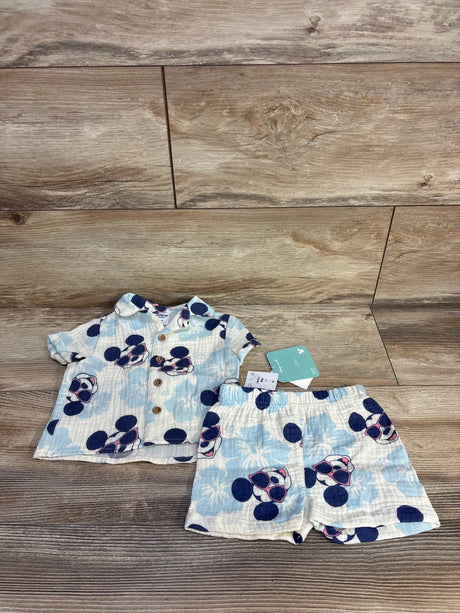Baby Disney-themed short sleeve shirt and shorts set with Mickey Mouse sunglasses print on wood floor