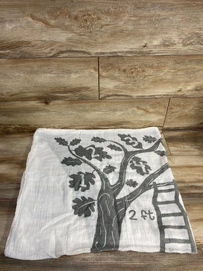 White cloth with black tree print, numbers 1-4 on branches, and a ladder, on wooden floor
