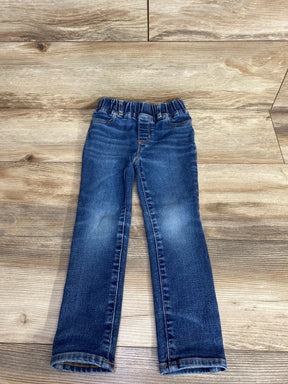 Blue denim kids jeans with elastic waistband on wooden floor