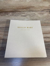 Hello Baby first years keepsake book on wood surface