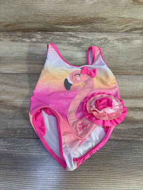 Flat lay of Betsey Johnson toddler one-piece swimsuit with embroidered flamingo, ruffle flower, pink ombre glitter