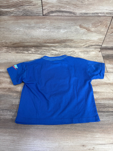 Back view of a blue children's Nike t-shirt on wooden floor, short sleeves, casual kidswear