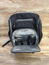 Front view of Fisher Price Kaden FastFinder diaper bag backpack showing open insulated front compartment with mesh pockets on wood floor background