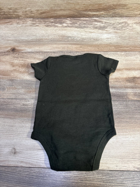Back view of green short-sleeve baby bodysuit showcasing crew neck, size 0-3 months, laid flat on wood background