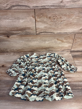 Cloud print long-sleeve toddler dress on wood floor, earth tones, ruffle waist