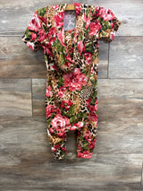 Baby romper with pink floral and leopard print pattern, short sleeves, displayed on wood background