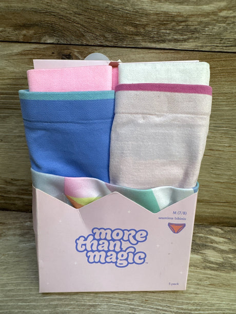 Front view of 5-pack More Than Magic seamless bikinis in pastel blue, pink, and cream inside pink box on wood background