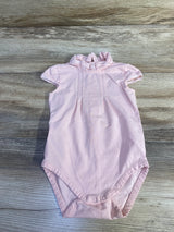 Front view of pink Mayoral ruffle-collar baby bodysuit showing lace-trim collar and snap crotch on wood background