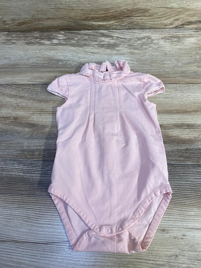 Front view of pink Mayoral ruffle-collar baby bodysuit showing lace-trim collar and snap crotch on wood background