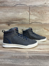 Kids' navy high-top sneakers with white soles and laces on wood background