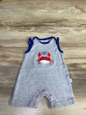 Flat lay of grey Millie & Myles shortie romper with navy trim, embroidered red crab and CUTE! text, sleeveless, snap crotch on wood