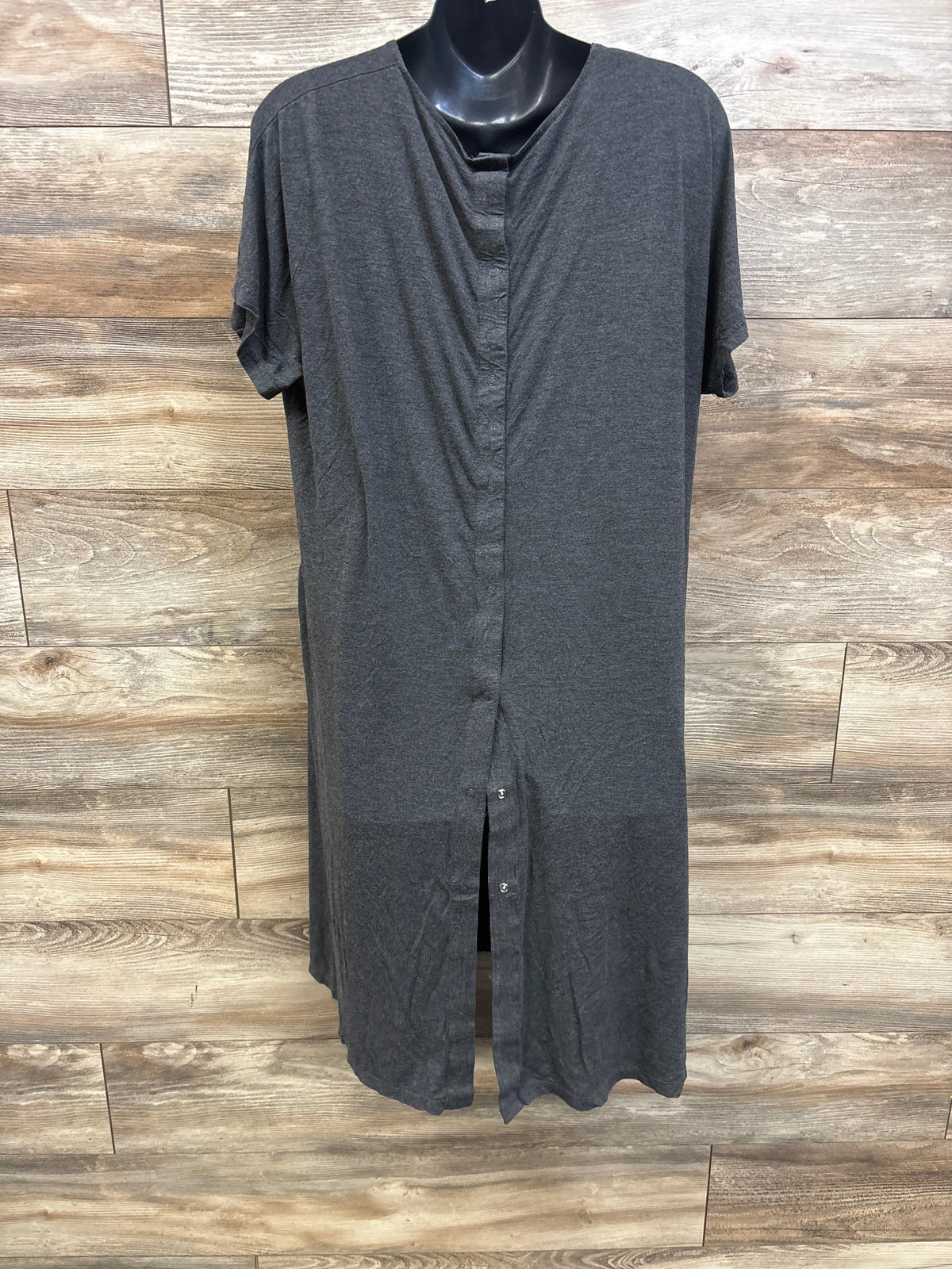 Front view of Frida Delivery and Nursing Gown showcasing short sleeves and button front opening with wood plank background