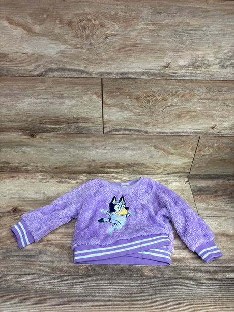 Purple plush Bluey sweatshirt for toddlers with white striped cuffs and hem.