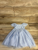Flat lay of Cat & Jack blue girls' tulle dress with puff sleeves and layered skirt on wood floor