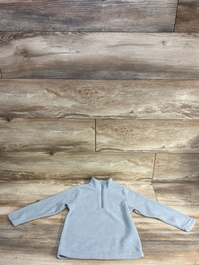 Light gray kids fleece pullover with half-zip front and long sleeves on wood background