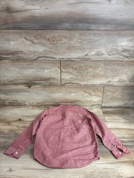 Back view of Janie and Jack red linen-cotton button-up shirt showing long sleeves and button cuffs on wood floor