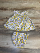 Floral baby dress and bloomers set with purple yellow flowers, perfect for spring outfits