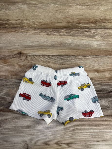 Flat-lay Old Navy white waffle-knit baby shorts with elastic pull-on waist and multicolored car print